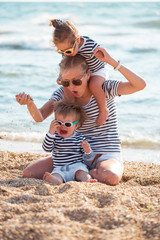 Mother with children on the beach