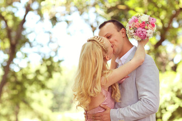 Beautiful couple celebrating in the park