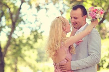 Fototapeta premium Beautiful couple celebrating in the park