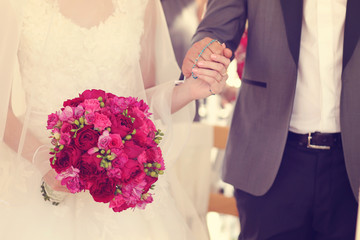 Bride holding pink wedding bouquet