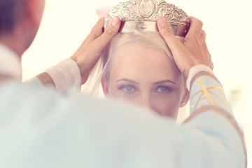 Priest putting the bride a crown