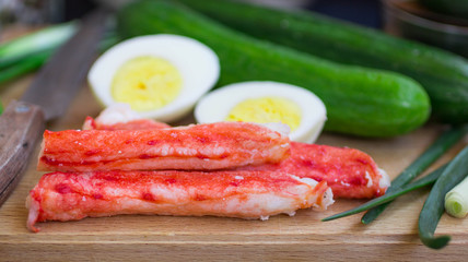 The ingredients to make the salad - crab, cucumber, egg, onion