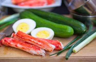 The ingredients to make the salad - crab, cucumber, egg, onion