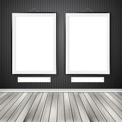 Gallery interior with two empty frames on wall