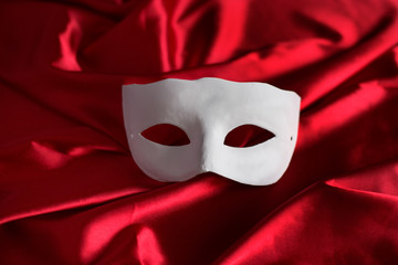 White mask on red background