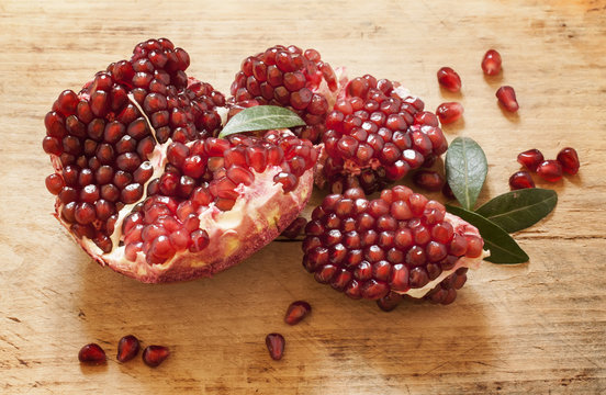 pomegranate with seeds and leaves