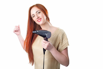 Redhead woman with long hair holding hair dryer