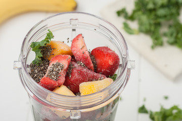 homemade breakfast smoothie ingredients in a blender cup