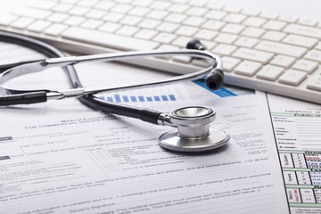 Clinic. Stethoscope with financial on the desk.