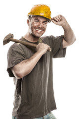 Young dirty Worker Man With Hard Hat helmet  .holding a hammer