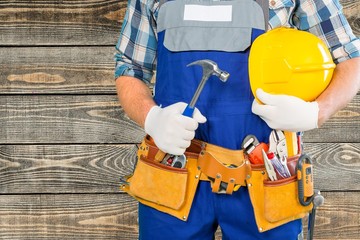 Handyman. Handyman with a tool belt. Isolated on white