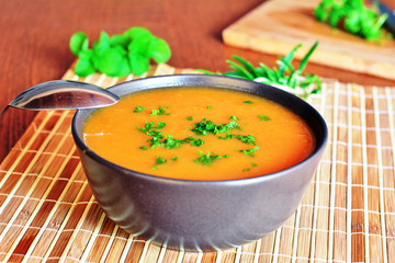 Pumpkin Creme Soup In The Bowl With Parsley