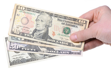 Hand with dollars isolated on white