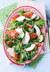 Green leaf salad with vegetables and chicken