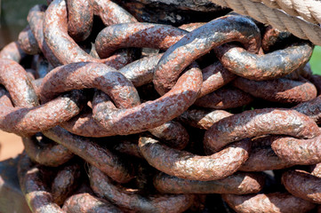 Rows of rusty chains. Heavy rusted metal chain