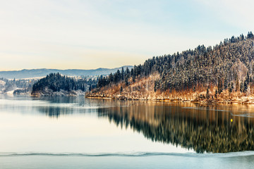 Panele Szklane  Zimowy wschód słońca nad jeziorem