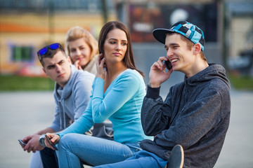 Group of teenagers looking at their friend 