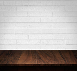 Wood table with White brick wall background