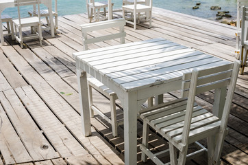 Fototapeta na wymiar Wood dock White chair and table