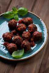 Close-up of meatballs with tomato sauce, selective focus
