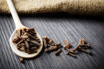 pile cloves on wooden spoon