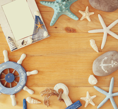 collection of nautical and beach objects creating a frame over w