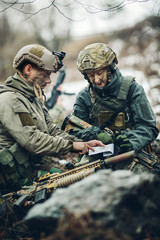 soldiers on the Outdoor of looking at the map
