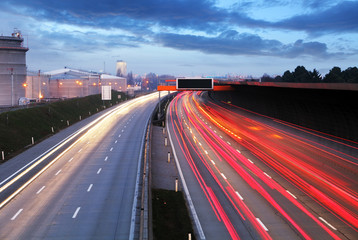 Speed Traffic at Dramatic Sundown Time - light trails on motorwa