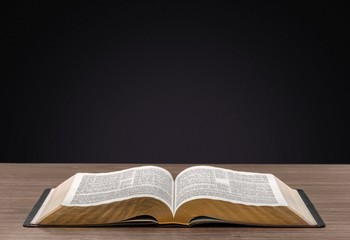 Arrows. Book on wooden deck with glowing graph illustrations and