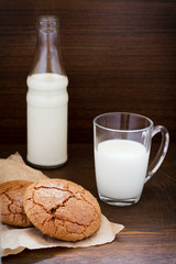 Almond cookies with a glass of milk in the back