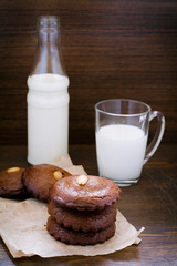 Almond cookies with a glass of milk  in the back