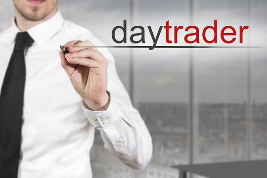 businessman writing daytrader in the air