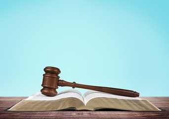 Legal System. Gavel over the opened law book