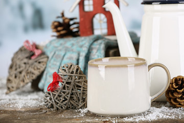 Winter composition with hot beverage on nature background