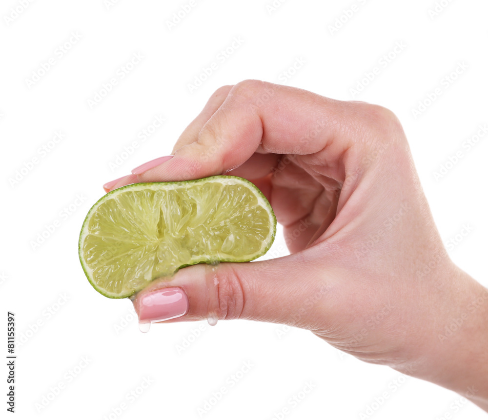 Canvas Prints female hand squeezing lime isolated on white