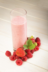smoothie of berries on the table in the garden