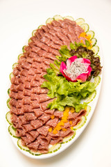 dish of mixed cold cuts.