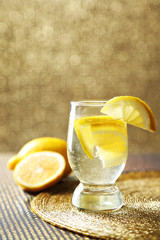 Glass of freshness lemonade, on bright background
