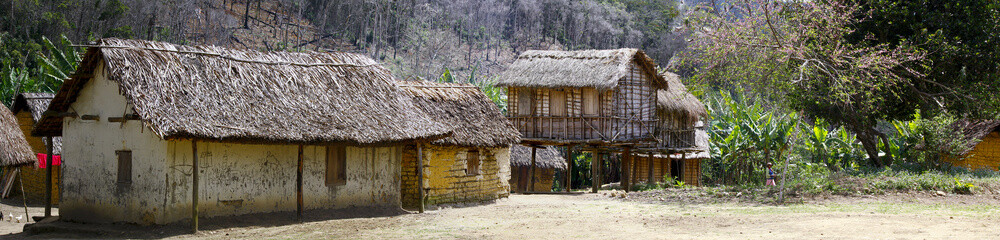 Typical malgasy village - african hut, poverty in madagascar