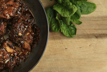 Pork ribs with honey-soy sauce in the frying pan