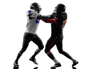 Fototapeta na wymiar two american football players on scrimmage holding silhouette