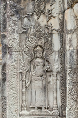 Fototapeta na wymiar the beautiful ancient carving on the stone at Angkor wat