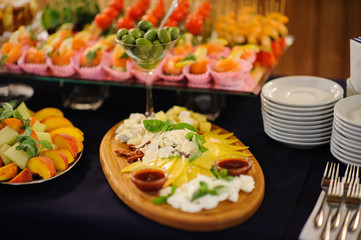 table set service with silverware and glass stemware at restaurant before party