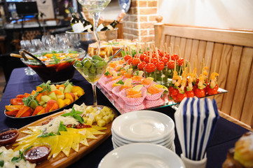 table set service with silverware and glass stemware at restaurant before party