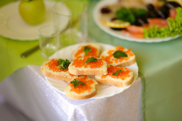 table set service with silverware and glass stemware at restaurant before party