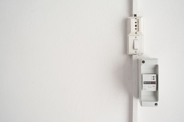 electricity meter in a white wall