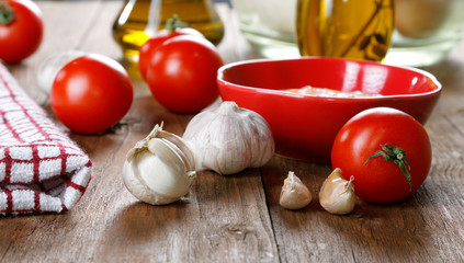Still life with tomatoes and garlic sauce