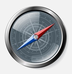 Steel detailed compass over grey background.