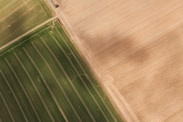 aerial view of spring time village harvest fields landscape