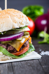 traditional pub style burger  on wooden table